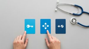 Hands pointing to three blue cards with icons representing health insurance options (key, network, plus symbol) next to a stethoscope, symbolizing the decision-making process for health plans like HMO, PPO, and EPO
